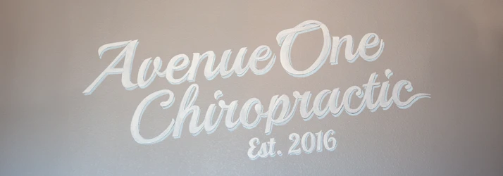 Wall sign displaying the text “Avenue One Chiropractic” with “Est. 2016” underneath.